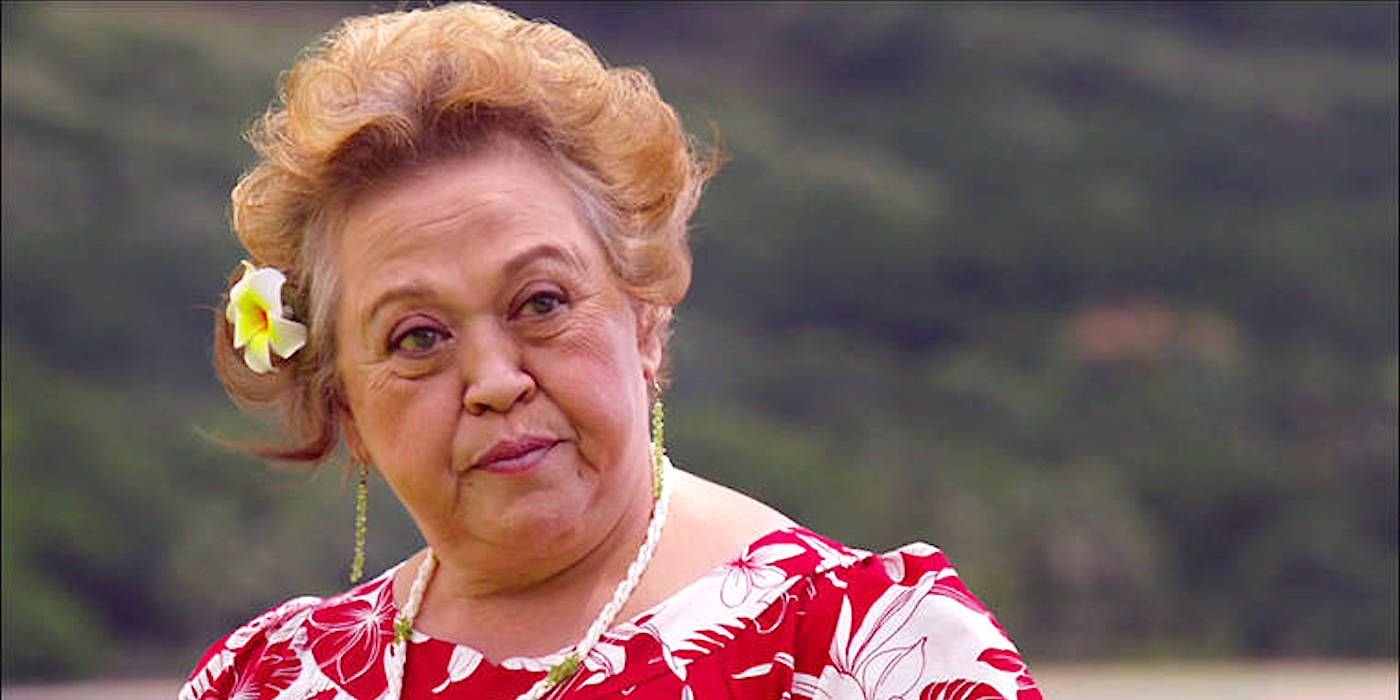 Amy Hill with a flower in her hair in a scene from the Magnum PI reboot