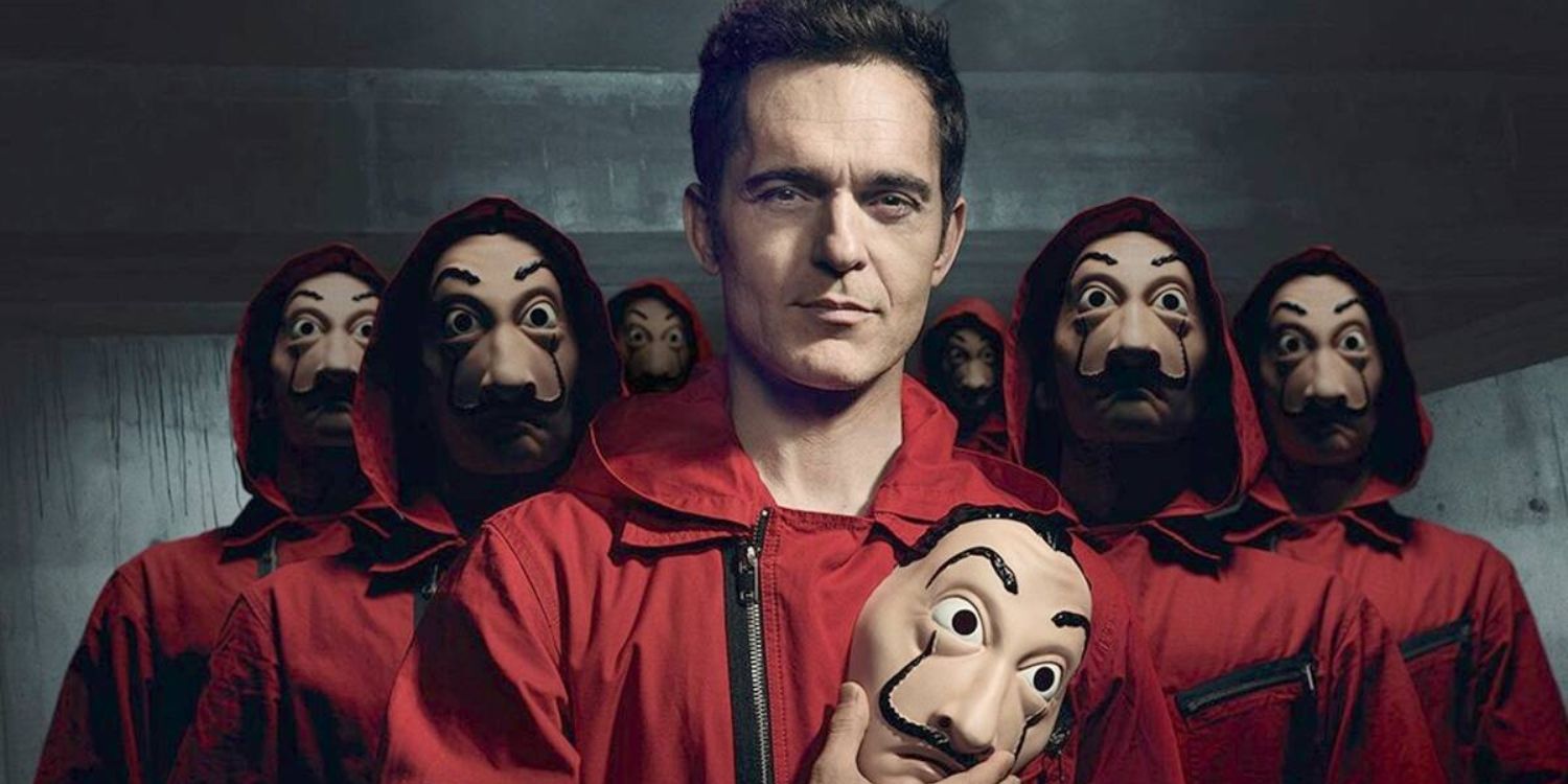 An image of Berlin holding a mask with the robbers behind him in Money Heist