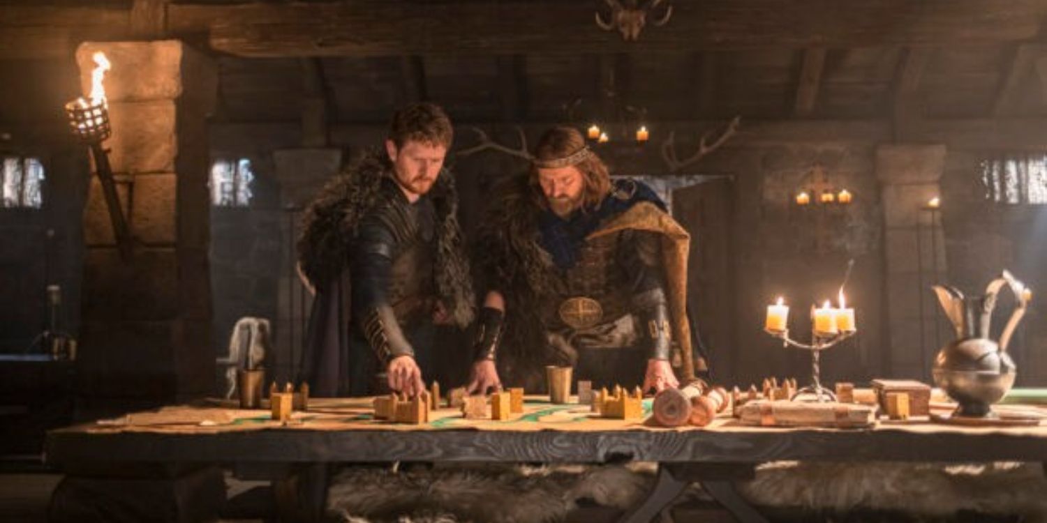 An image of Domnal and Constantin standing over a table in The Last Kingdom