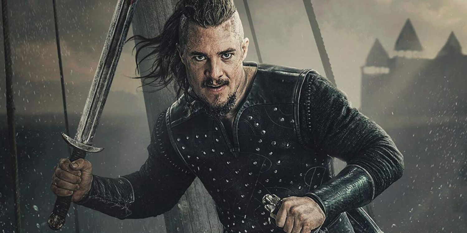 An image of Uhtred holding two swords in The Last Kingdom