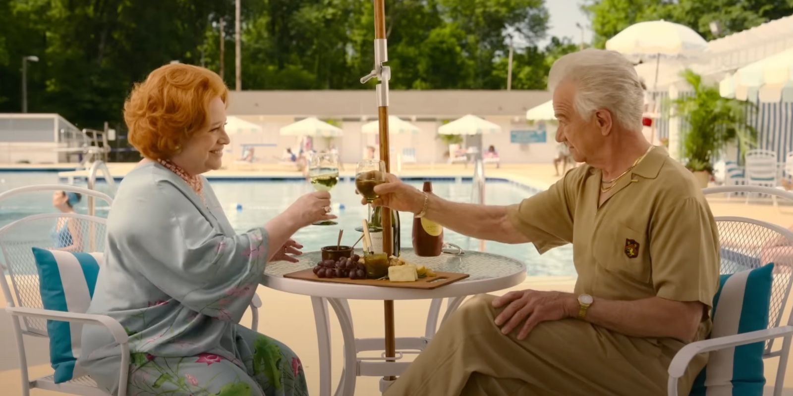 Sylvia and her new boyfriend having drinks by the pool in Are You There God It&rsquo;s Me Margaret