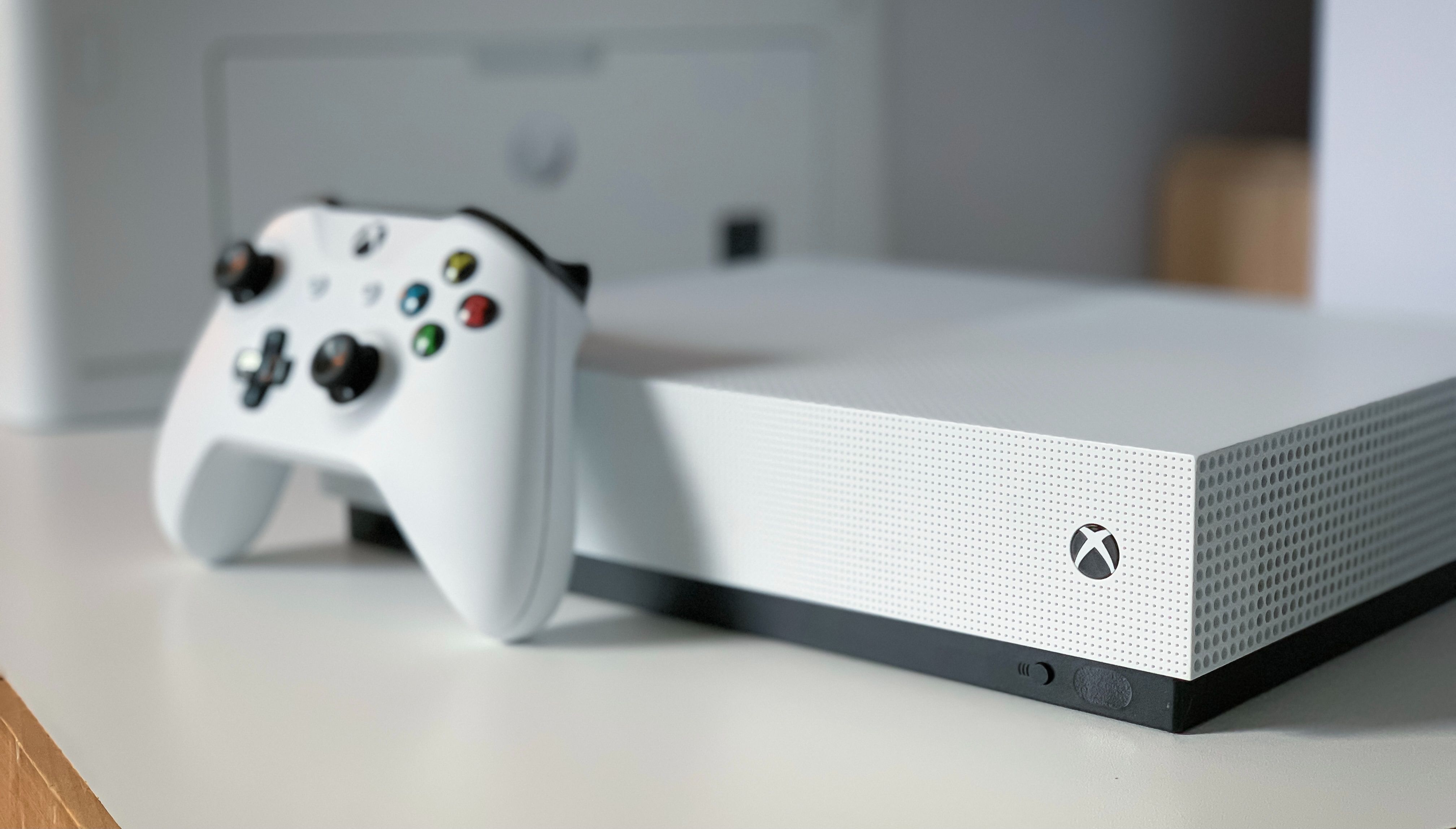 White xbox one console with a white controller.