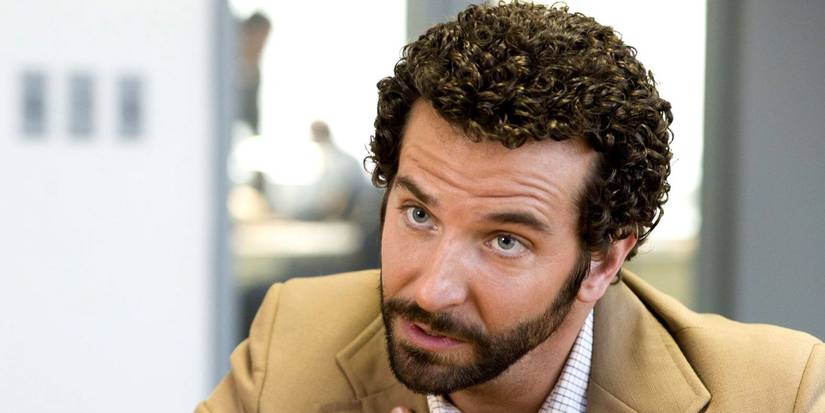 Bradley Cooper looking sideways in American Hustle
