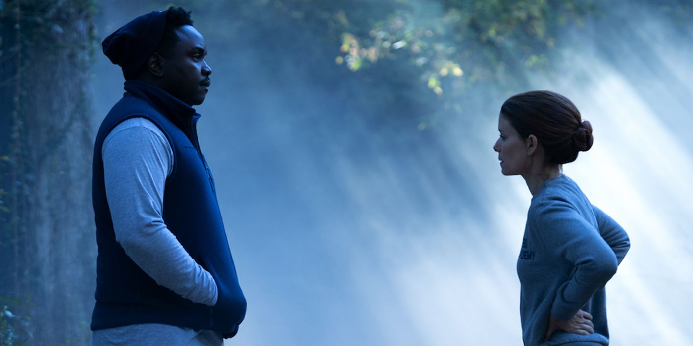Brian Tyree Henry and Kate Mara in Class of 09 standing in the woods