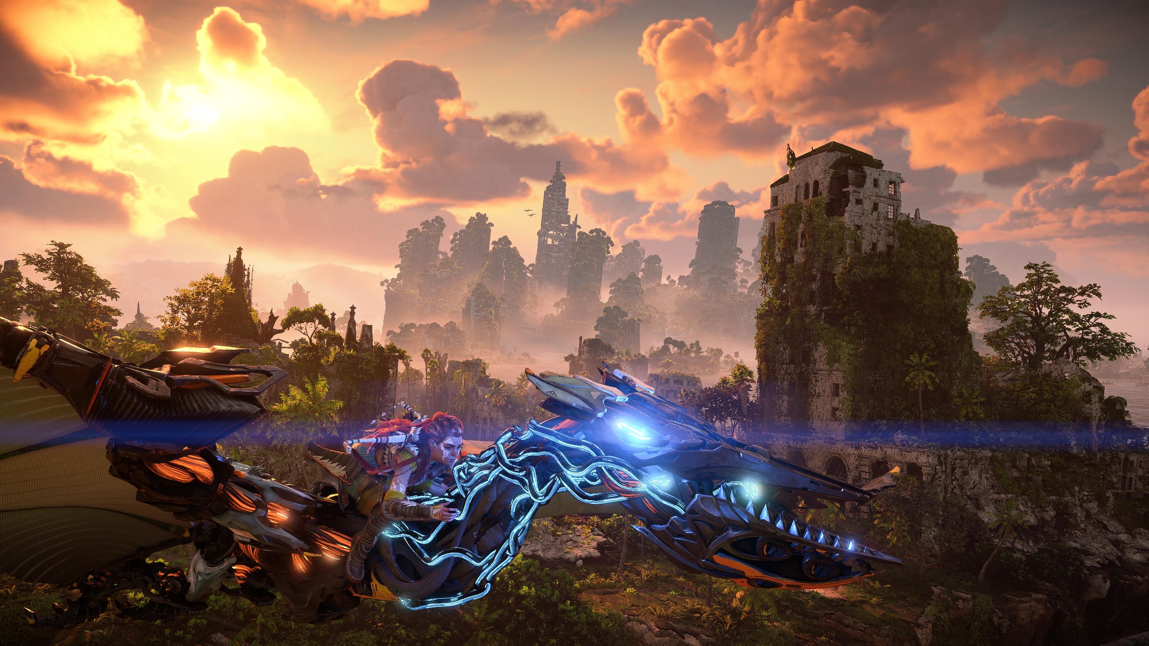 Aloy flying on a Waterwing in front of the sunsetting on the ruins of Los Angeles in Horizon Forbidden West: Burning Shores.
