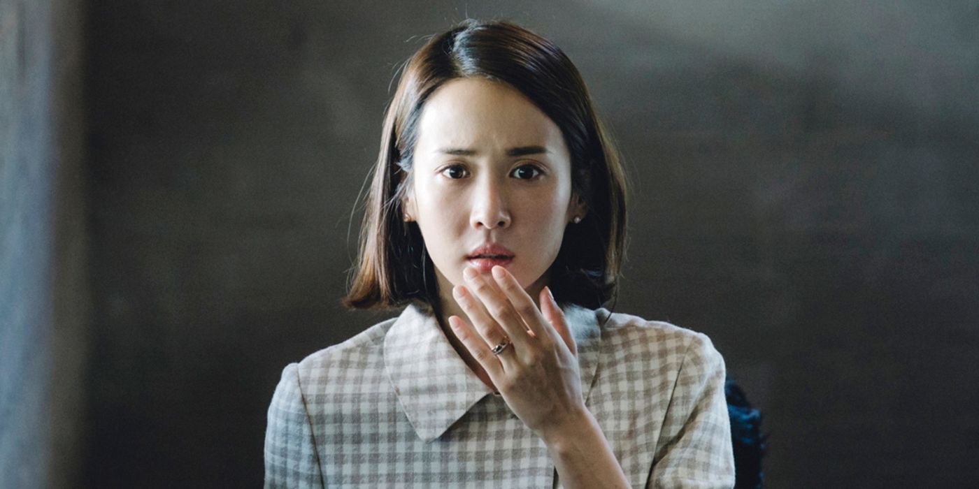 Cho Yeo-jeong Choi Yeon-gyo holds her hand up to her worried face in a scene from Parasite.