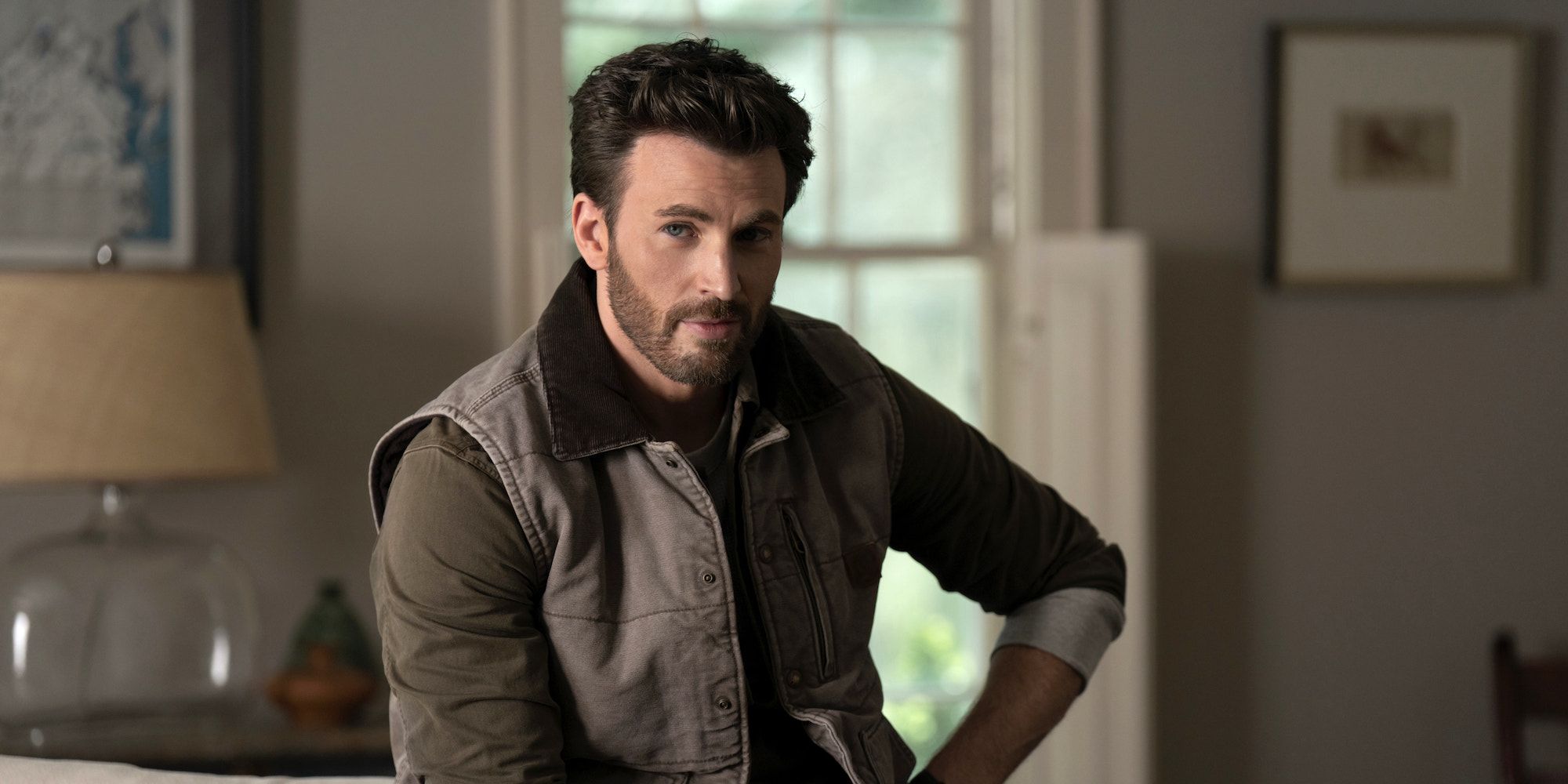 Chris Evans As Cole In a Vest Jacket In the Apple TV Plus Movie Ghosted