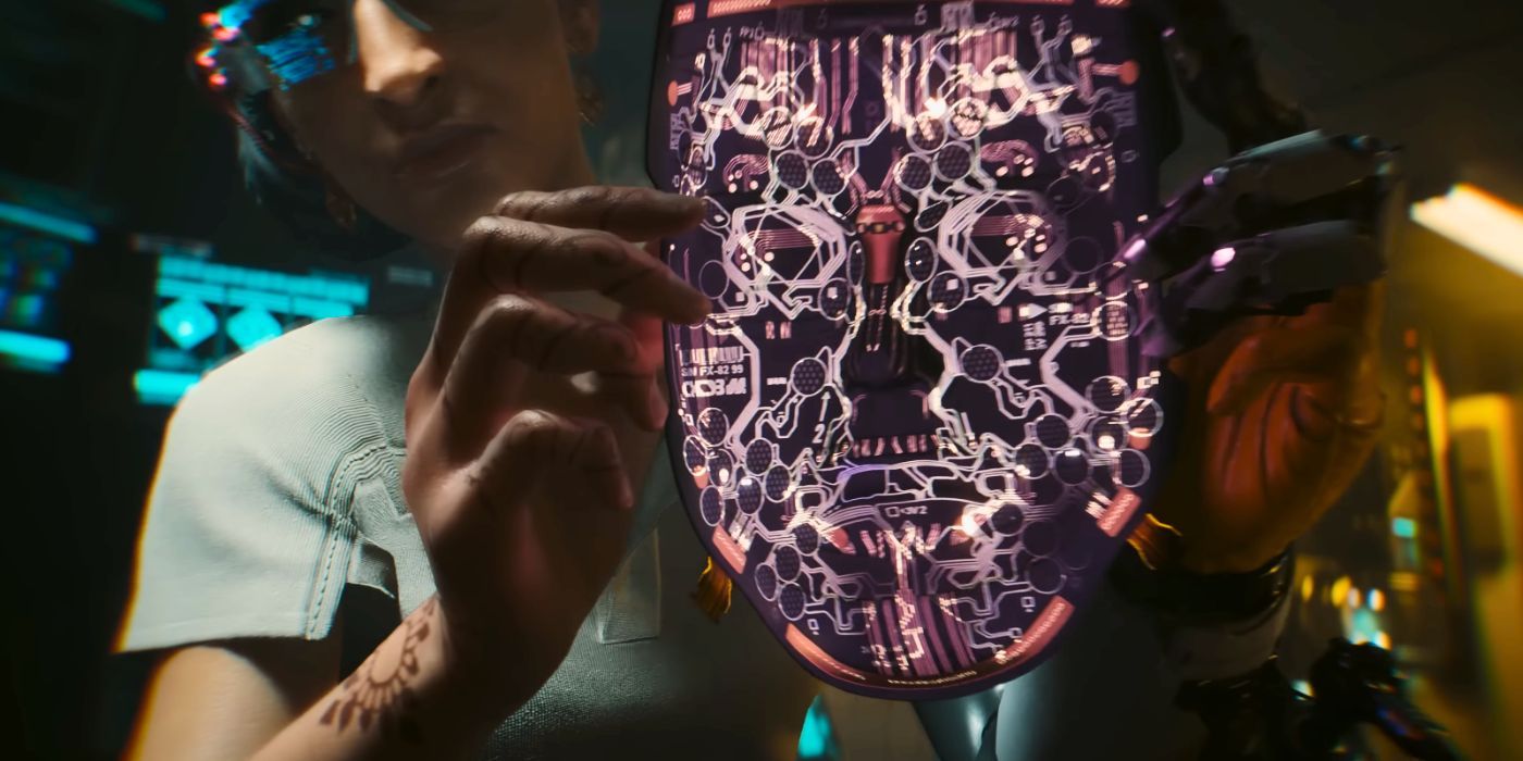 Bidikan dari trailer Phantom Liberty Cyberpunk 2077 di mana karakter wanita tampaknya menempatkan semacam alat topeng kabel di wajah V