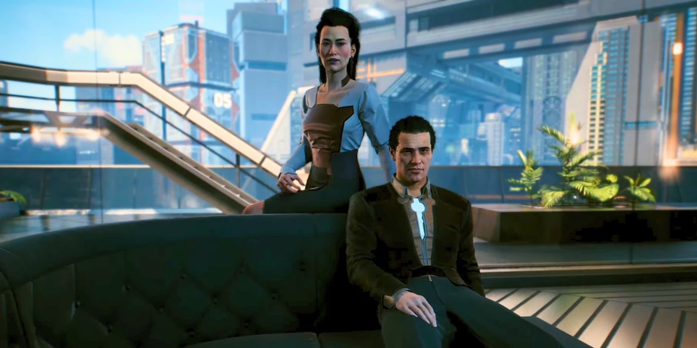 El Sr. y la Sra. Peralez sentados en su sofá y hablando con V en Cyberpunk 2077.