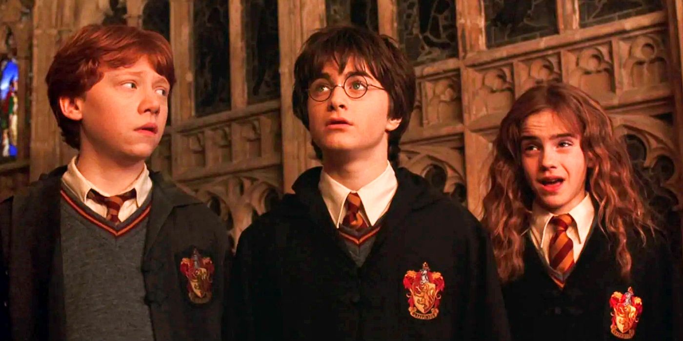 Daniel Radcliffe, Rupert Grint, and Emma Watson look surprised in Harry Potter 2