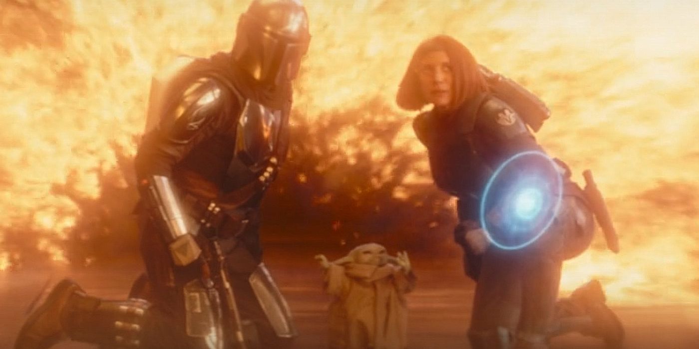 Grogu using the Force to protect Din and Bo-Katan from an explosion.