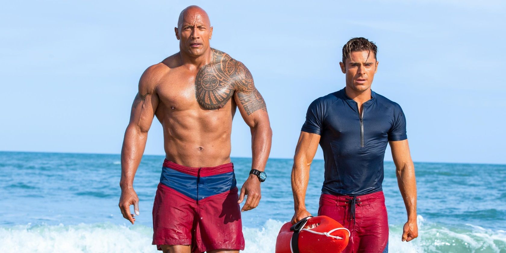 Dwayne Johnson and Zac Efron on the beach in Baywatch