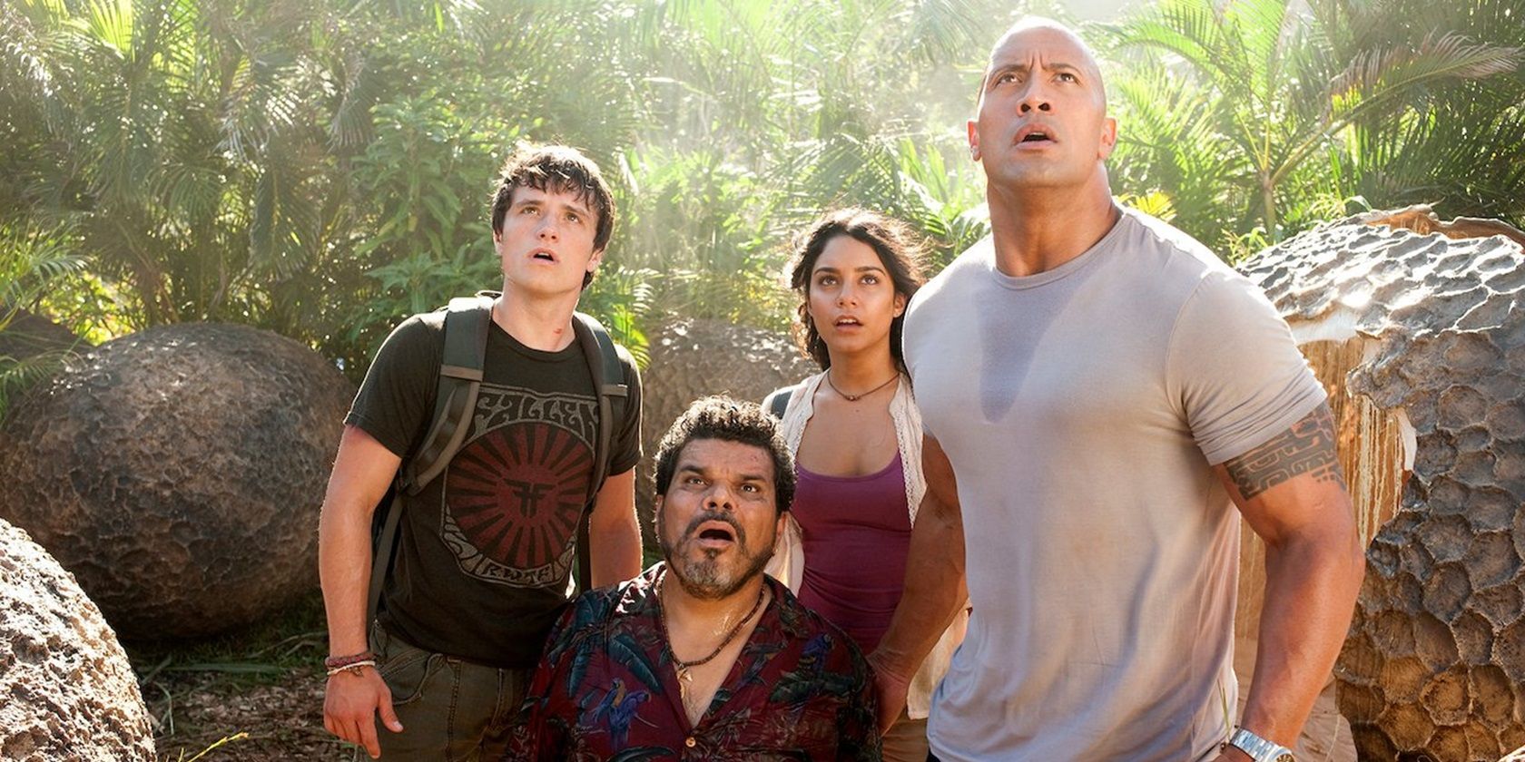 Dwayne Johnson and the cast of Journey 2: The Mysterious Island looking up in shock