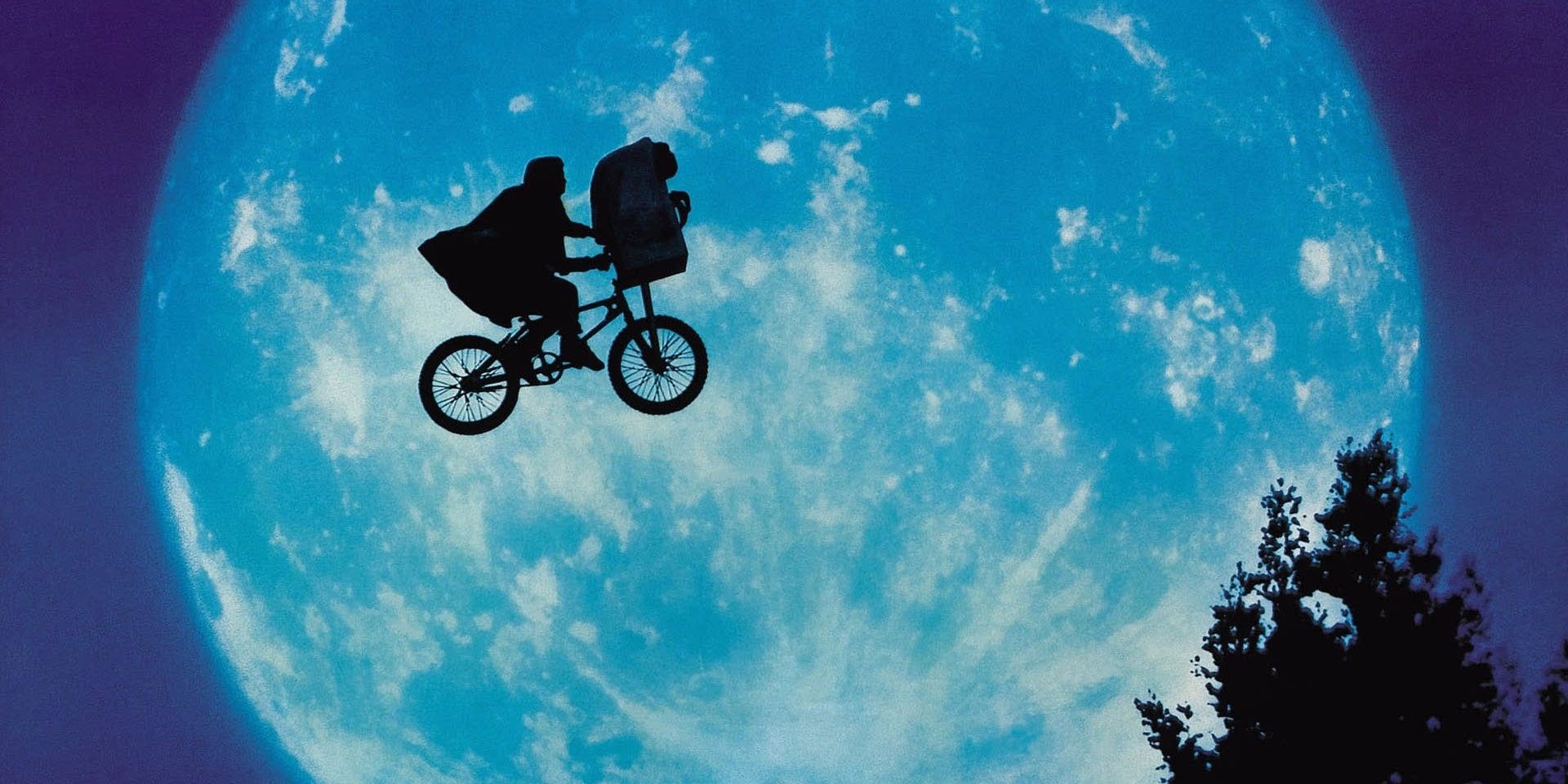 Elliott and ET fly past the Moon in ET the Extra-Terrestrial