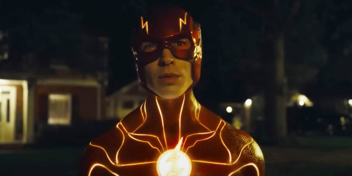 Ezra Miller in a scene from The Flash movie trailer, wearing the new suit at night.