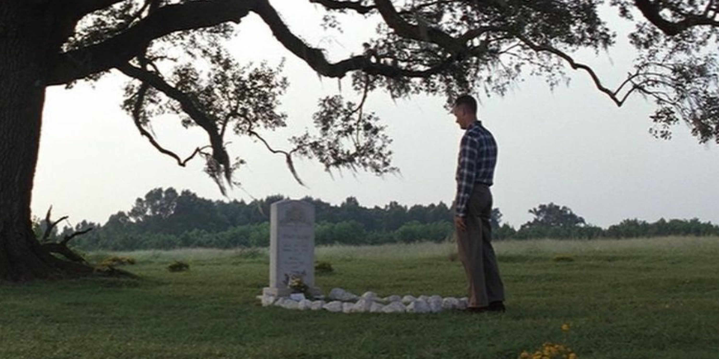 Forrest standing over Jenny's grave in Forrest Gump