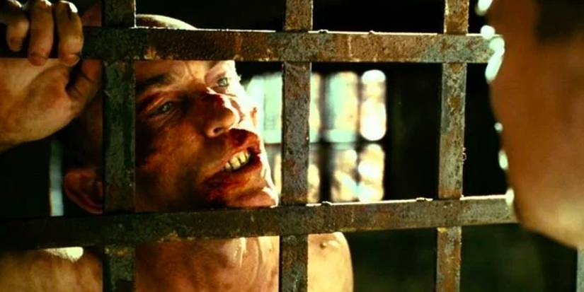 George Noyce (Jackie Earle Haley) leaning against prison bars in Shutter Island