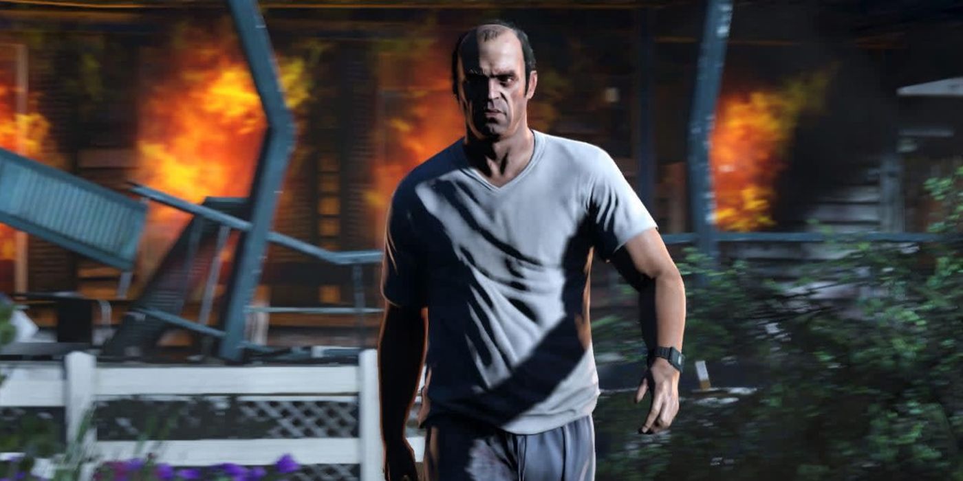 Trevor walks away from a burning house toward the camera in GTA 5.