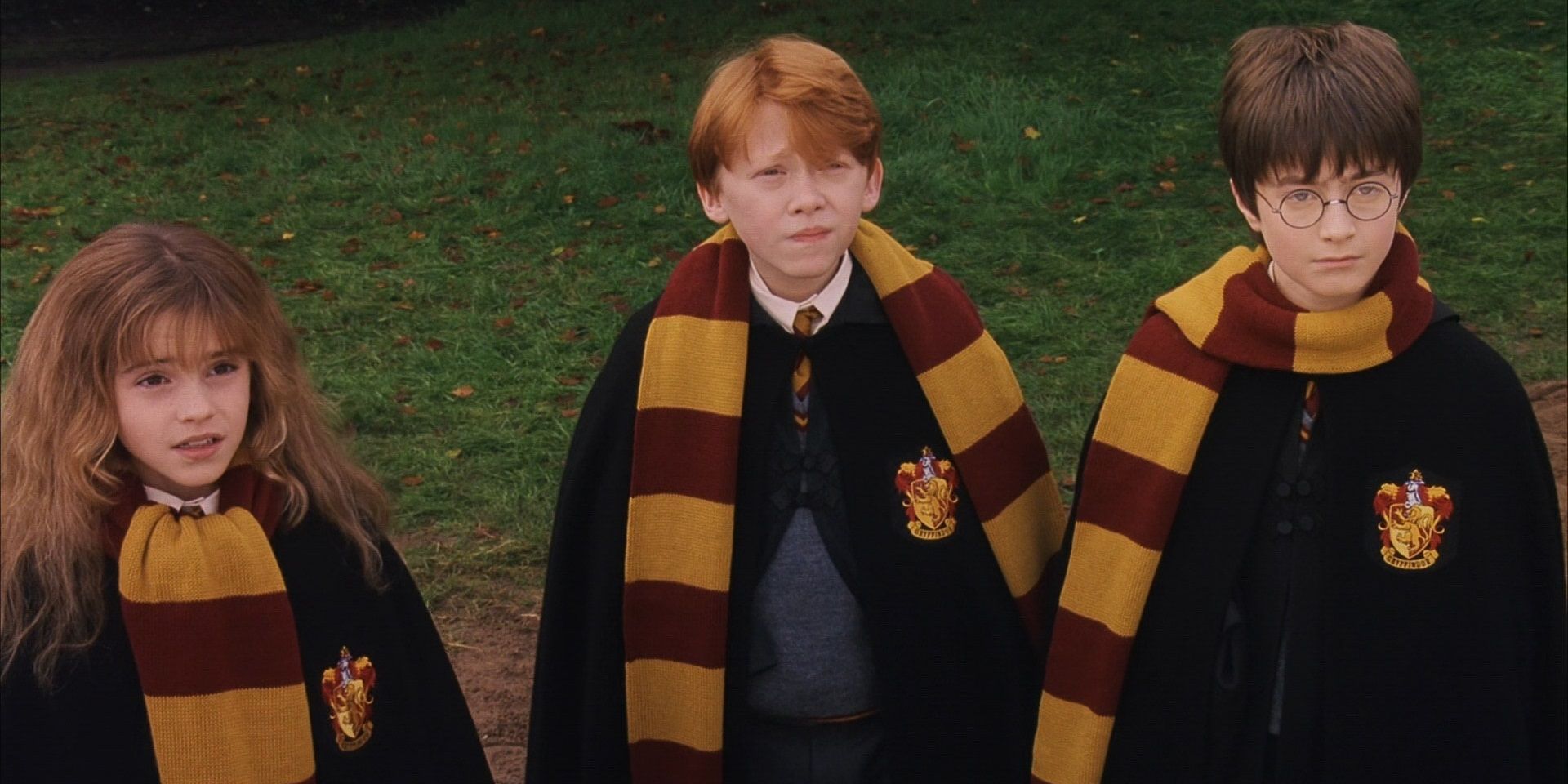 Harry, Ron, and Hermione look up in Harry Potter and the Sorcerer's Stone