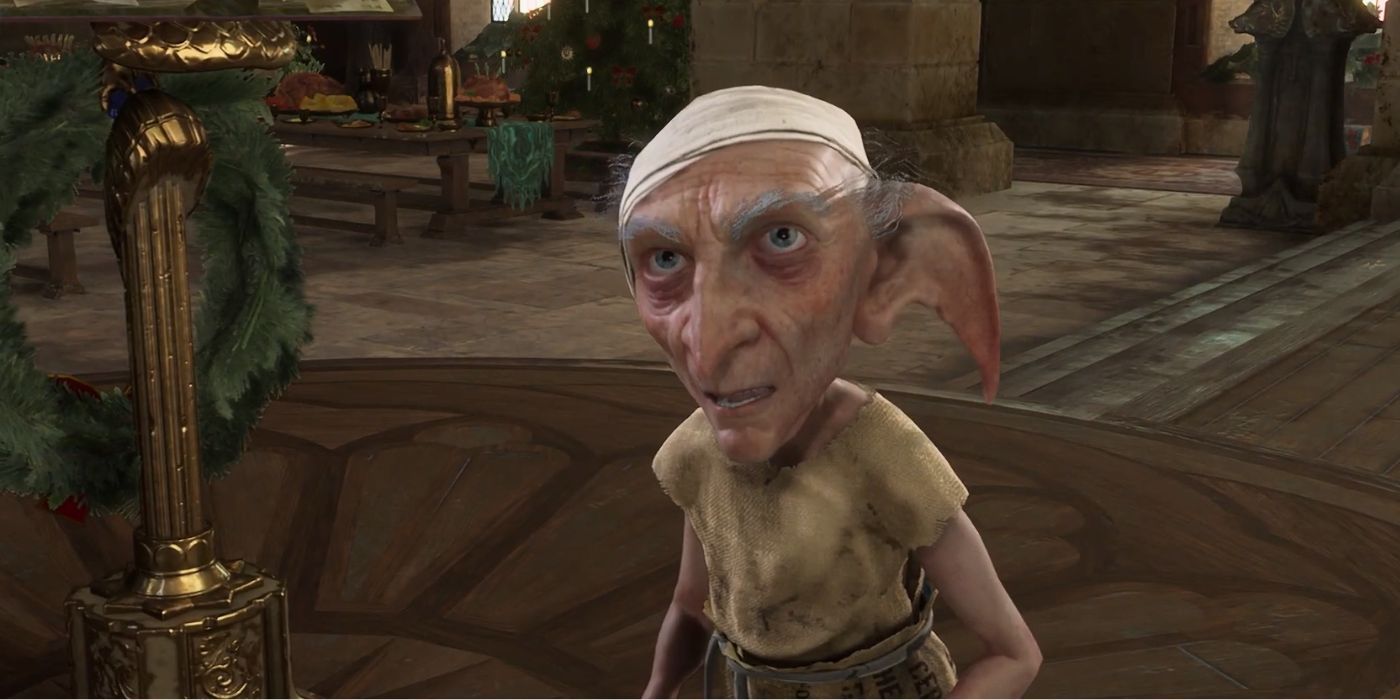 A close up of Scrope the House Elf in Hogwarts Legacy, speaking to an off-screen student disguised as Headmaster Black.