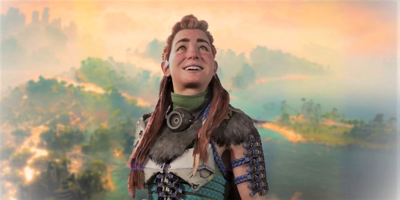Aloy looking up at the sky and smiling against a landscape from Horizon Forbidden West Burning Shores.