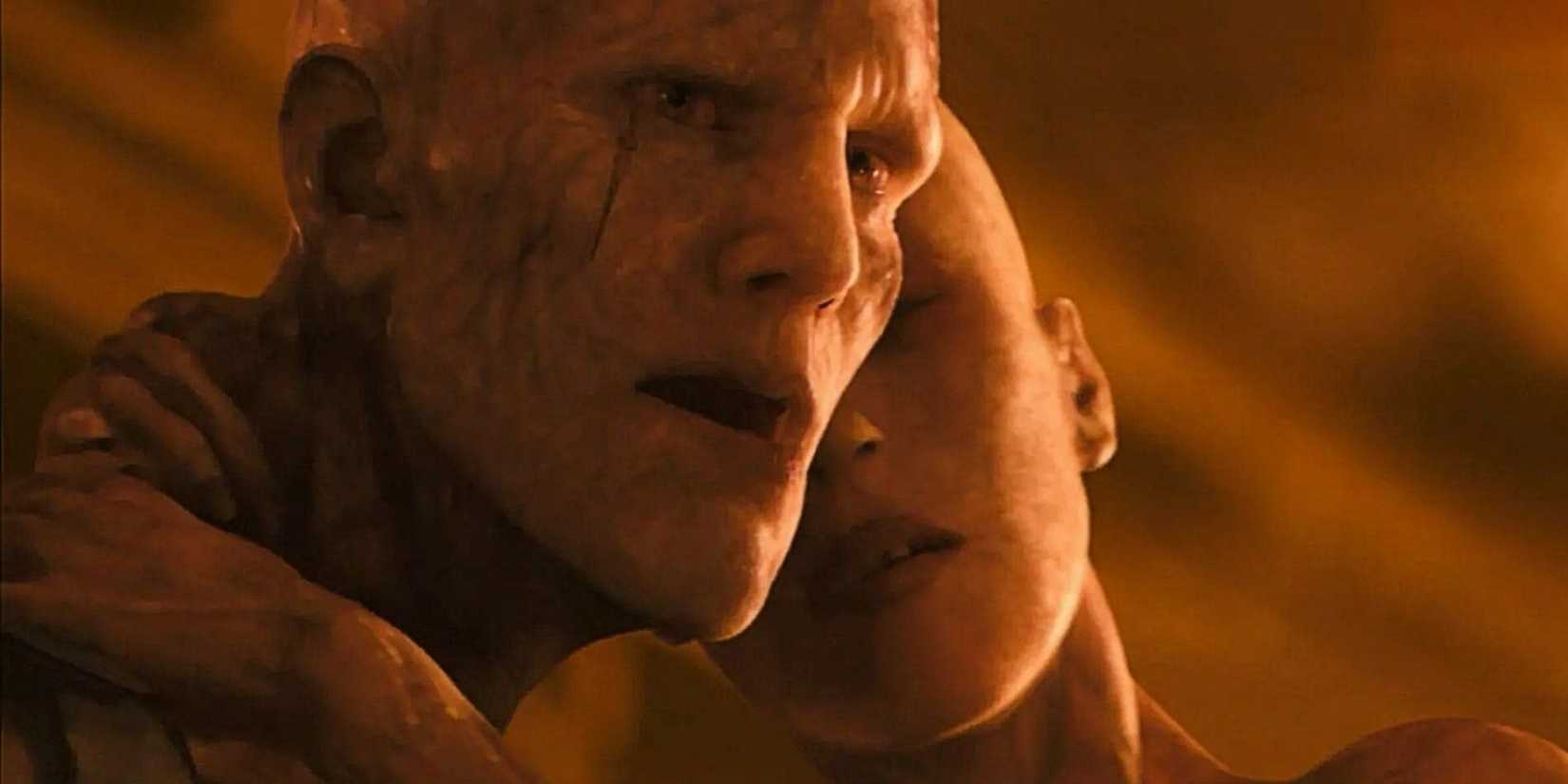  The Alpha Male (Dash Mihok) Darkseeker holds the Alpha Female (Joanna Numata) in the alternate ending of I Am Legend.