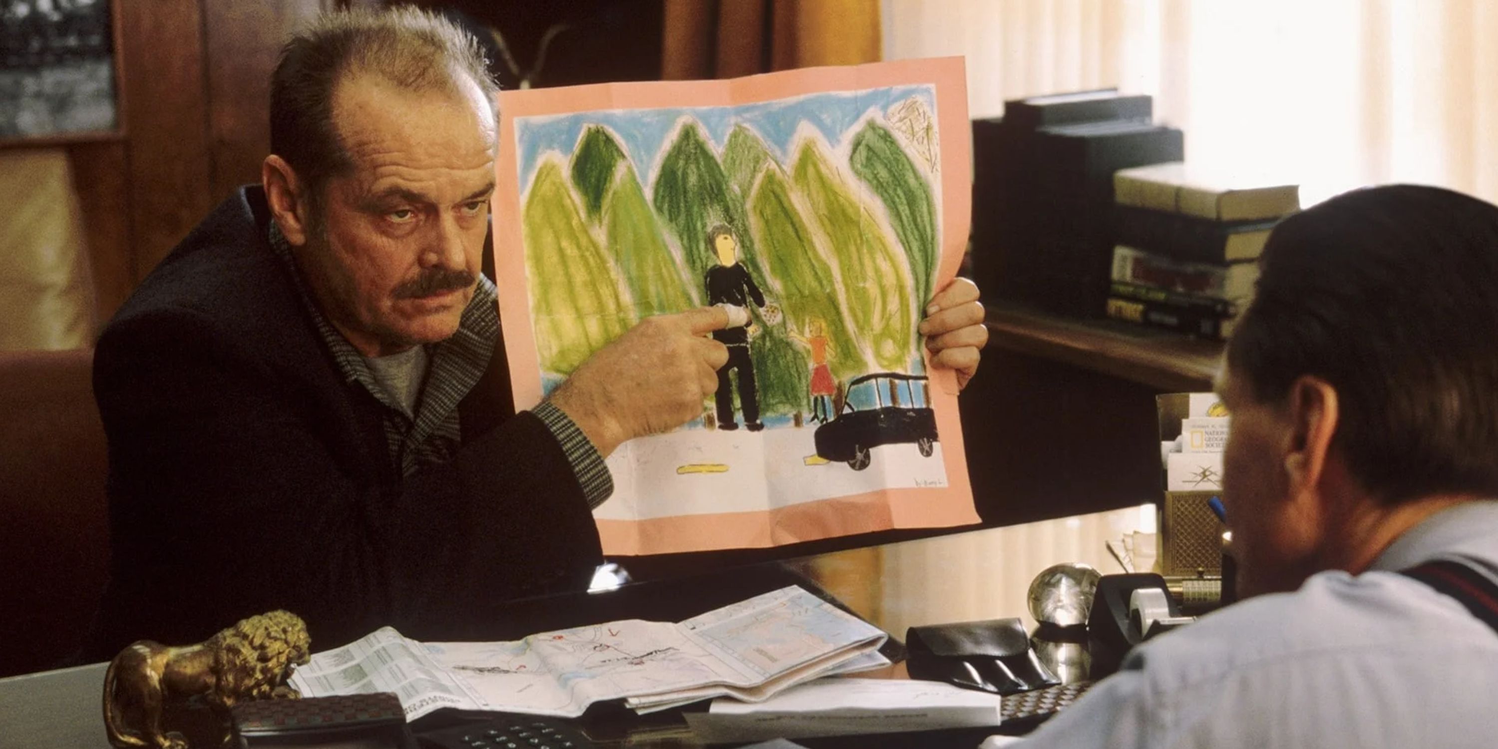 Jack Nicholson pointing at a picture in The Pledge