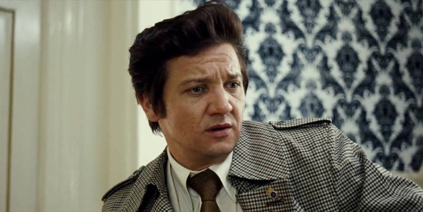 Jeremy Renner looking sideways in American Hustle