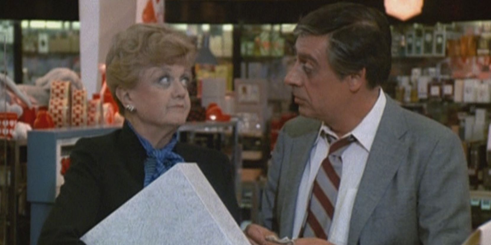 Jessica Fletcher and Harry McGraw look at one another in Murder She Wrote
