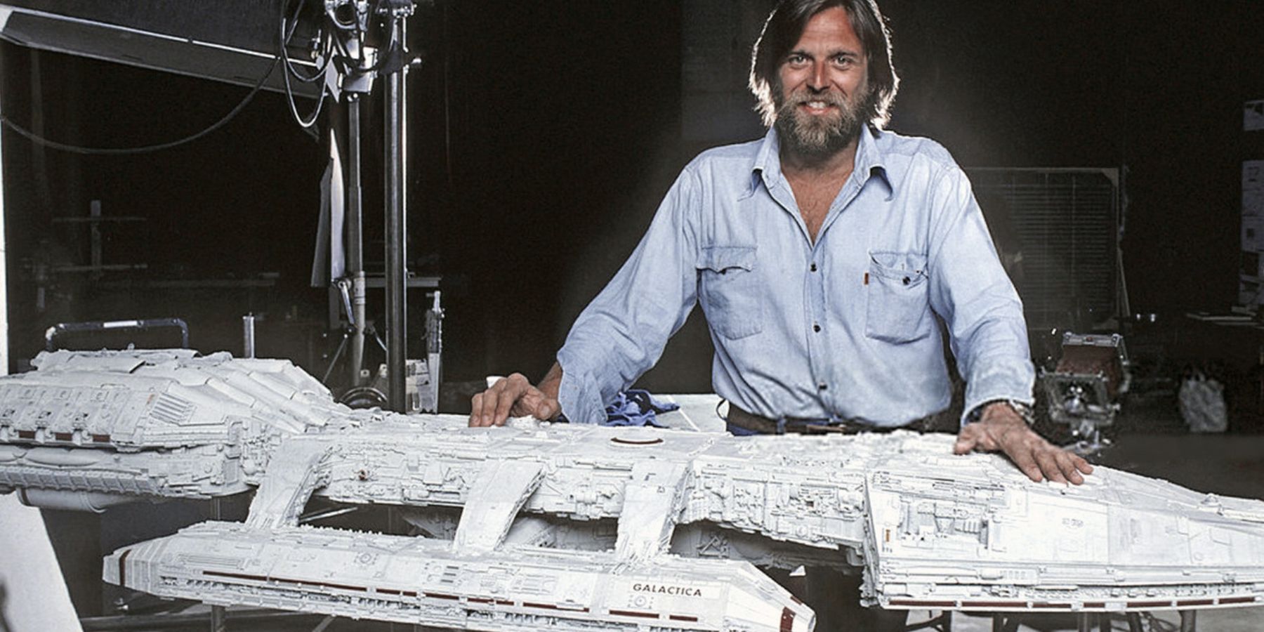 VFX artist John Dykstra with a model of the original Battlestar Galactica