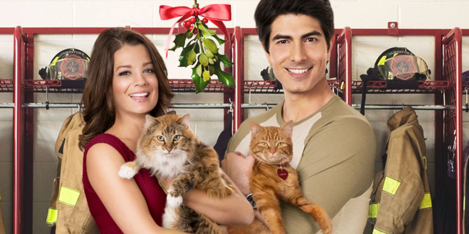 Kimberly Sustad and Brandon Routh in a promotional image with two cats for The Nine Lives Of Christmas