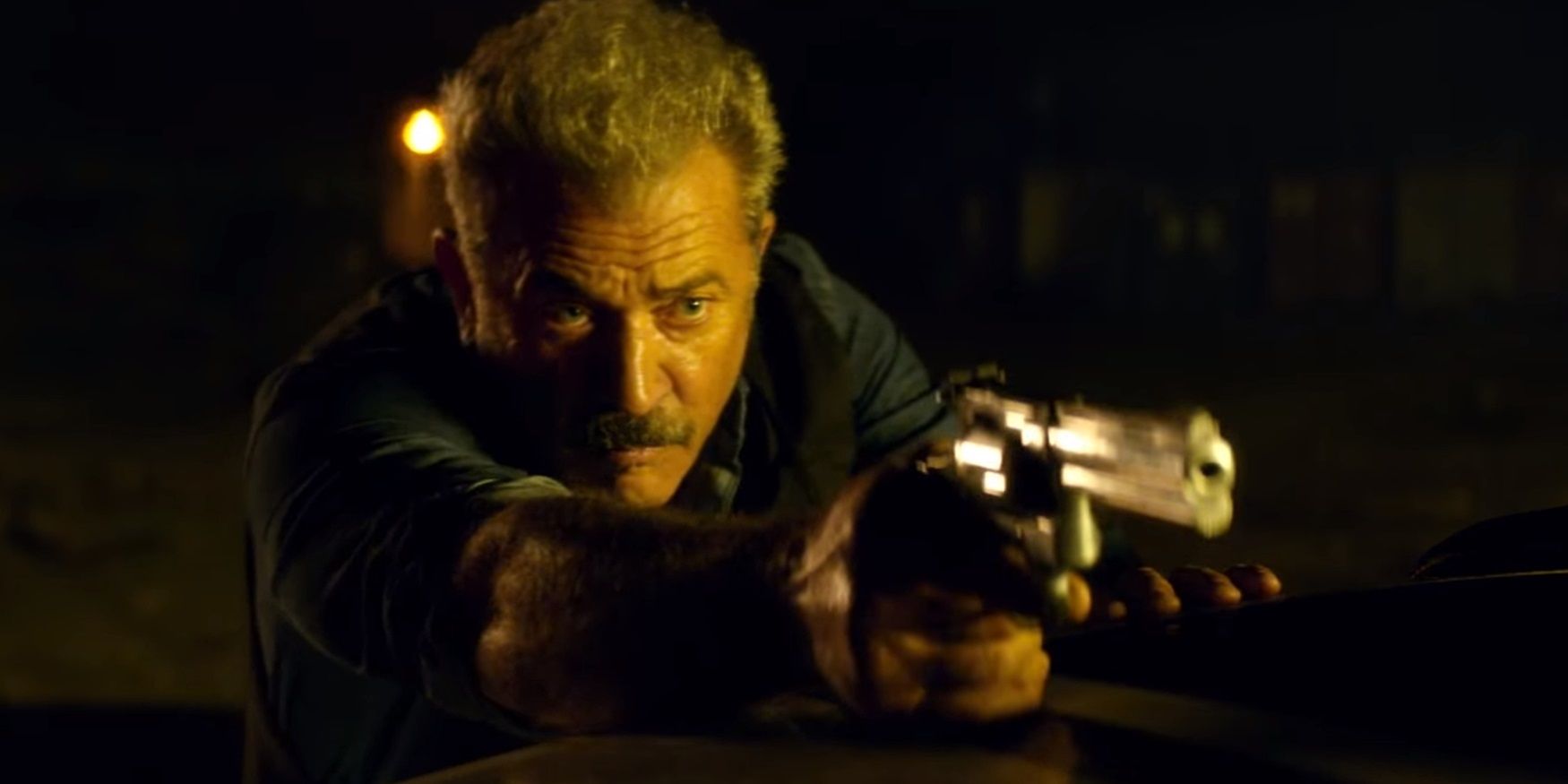 Mel Gibson with a gun in Dragged Across Concrete