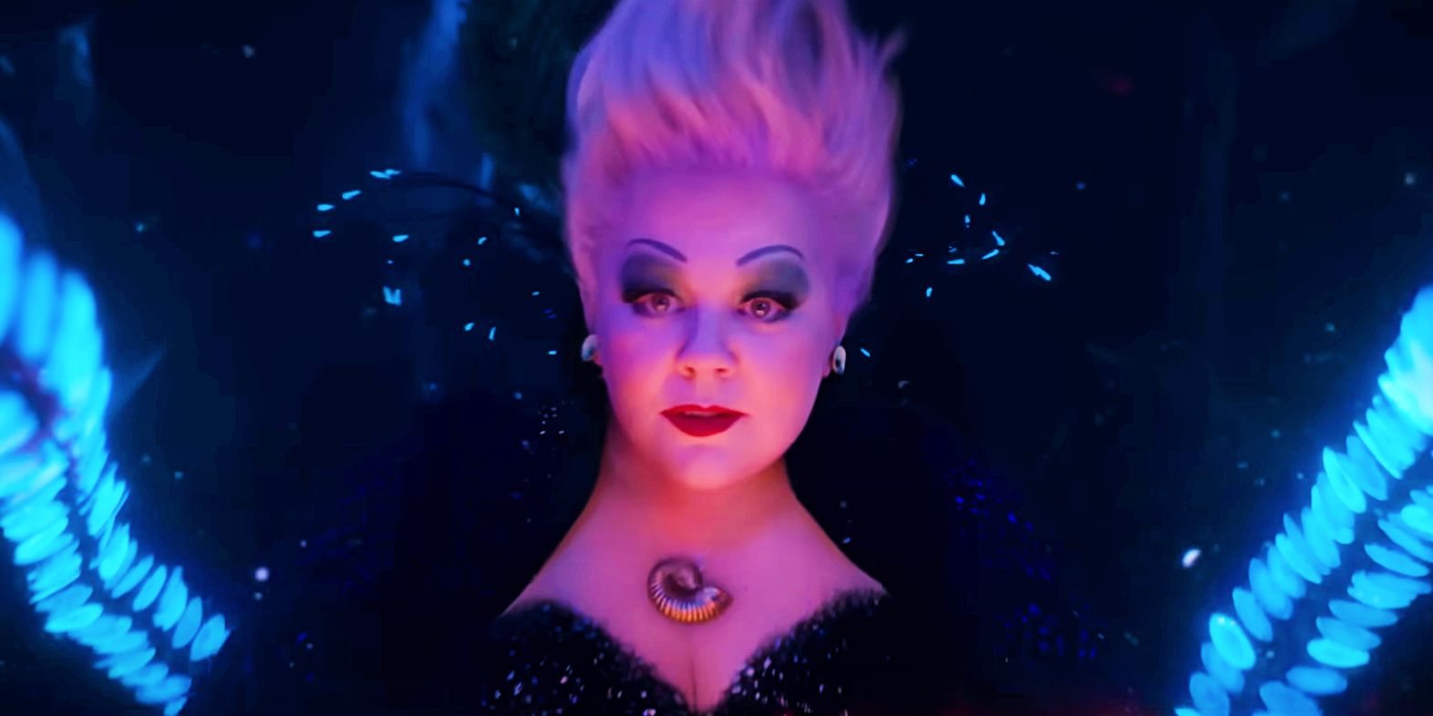 Melissa McCarthy as Ursula with tentacles on either side of her in The Little Mermaid