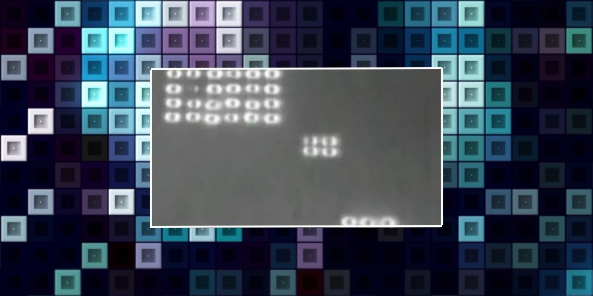 Permainan Tetris mikroskopis, lingkaran putih yang sangat abu-abu dan sulit dilihat pada latar belakang balok.