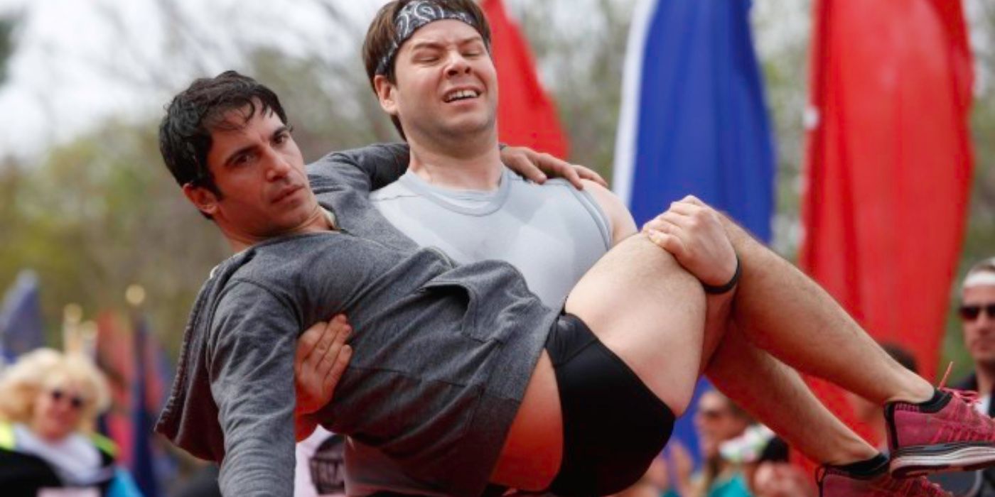 Morgan carrying Danny in the Triathlon The Mindy Project
