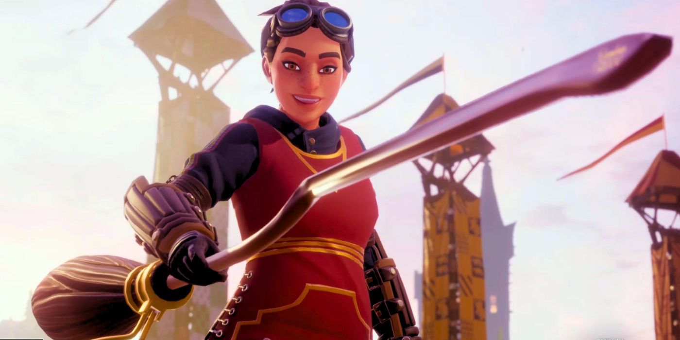 A female Gryffindor Quidditch player holding up her broom and looking down at it with a smile in Harry Potter: Quidditch Champions