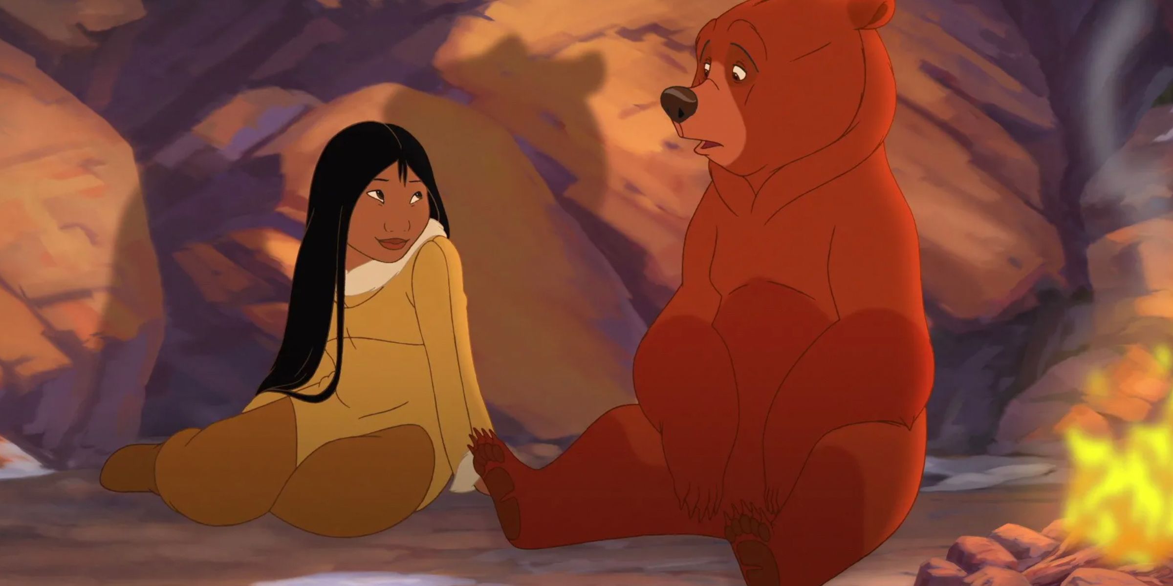 Nita as a human sits next to Kenai as a bear in Brother Bear 2