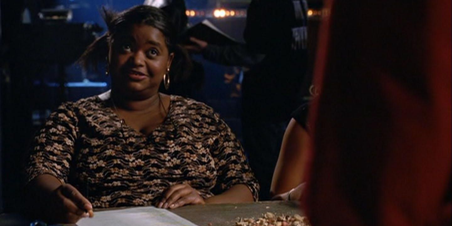 Octavia Spencer at a check-in desk in Spider-Man