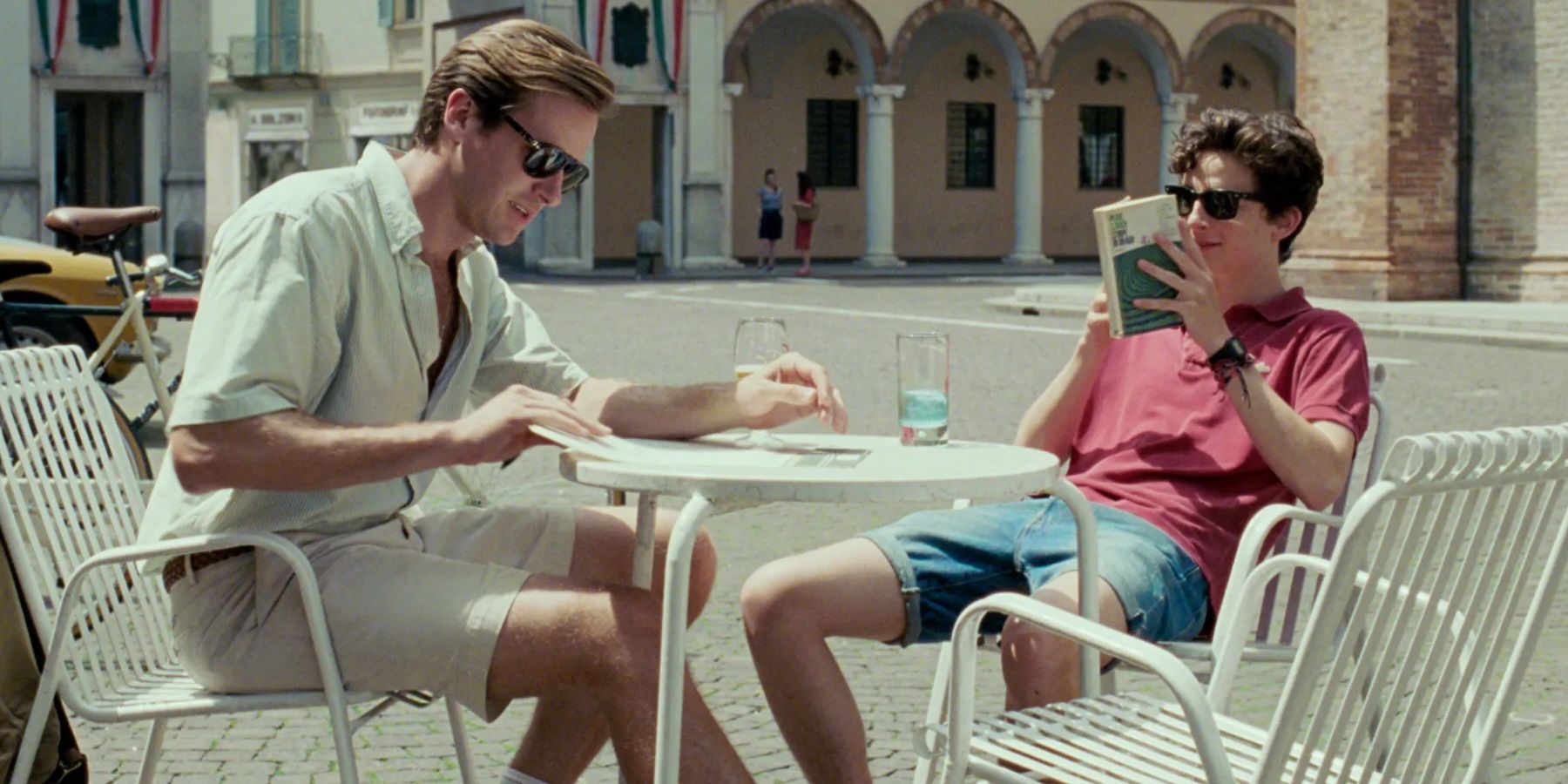 Oliver and Elio sitting in the sun in Call Me By Your Name