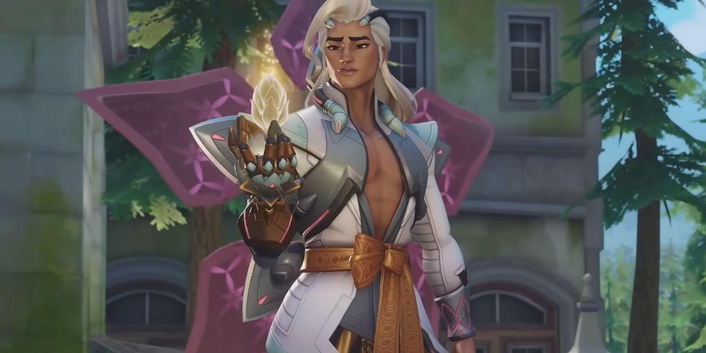 Lifeweaver holding a golden lotus flower in the palm of his hand in Overwatch 2.