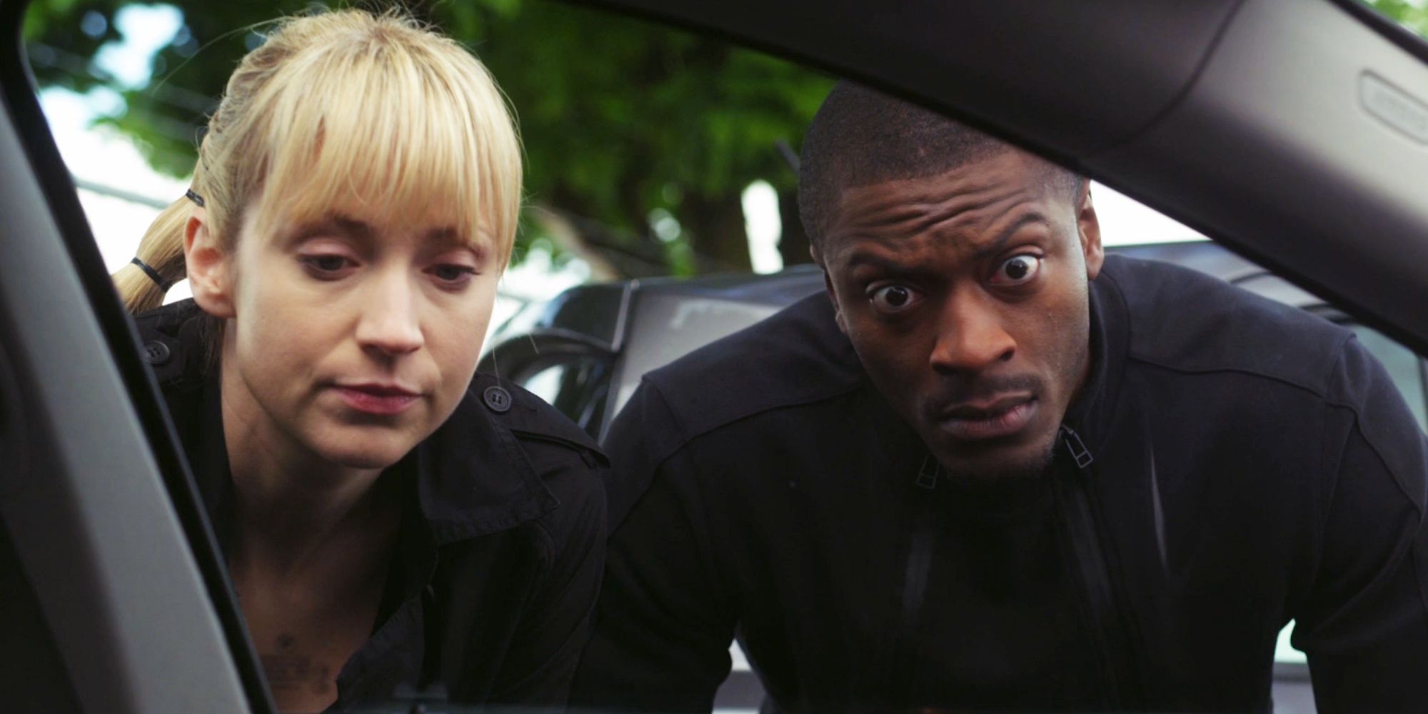 Parker and Hardison looking into a car in Leverage