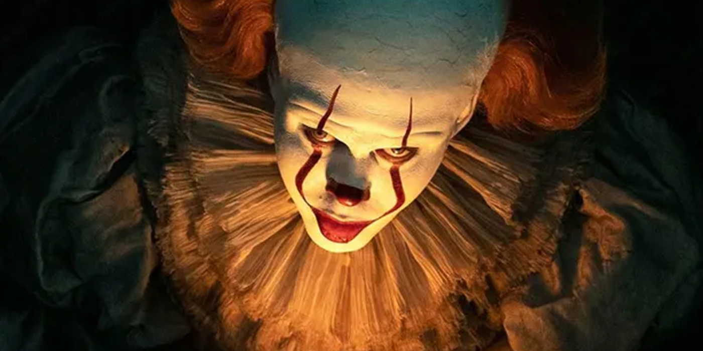 Pennywise looking out from the shadows in IT: Chapter Two