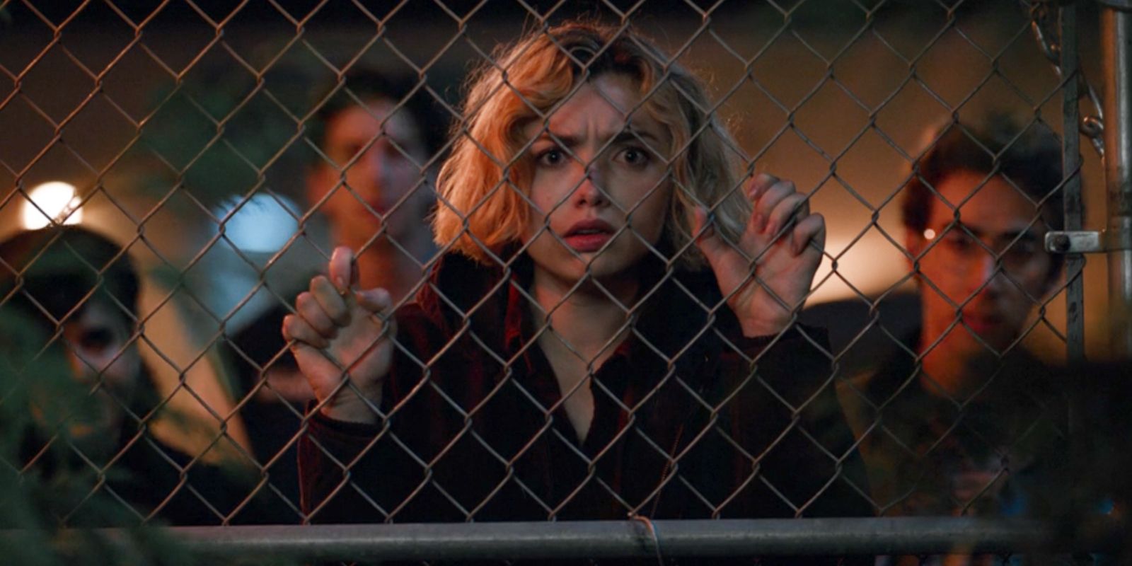 Peyton List as Maddie Nears with friends at a gate in School Spirits