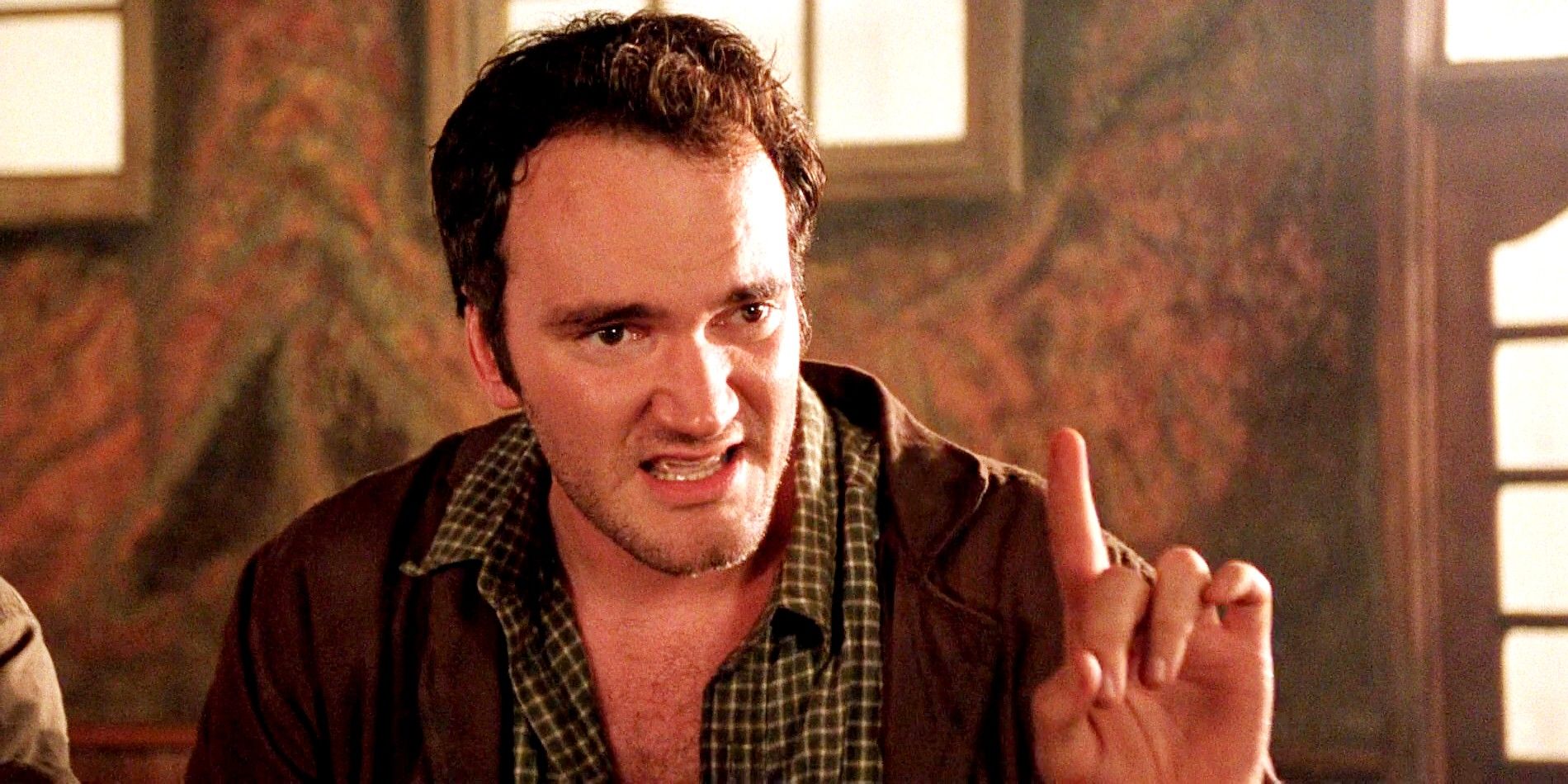 Quentin Tarantino points his finger up in Desperado