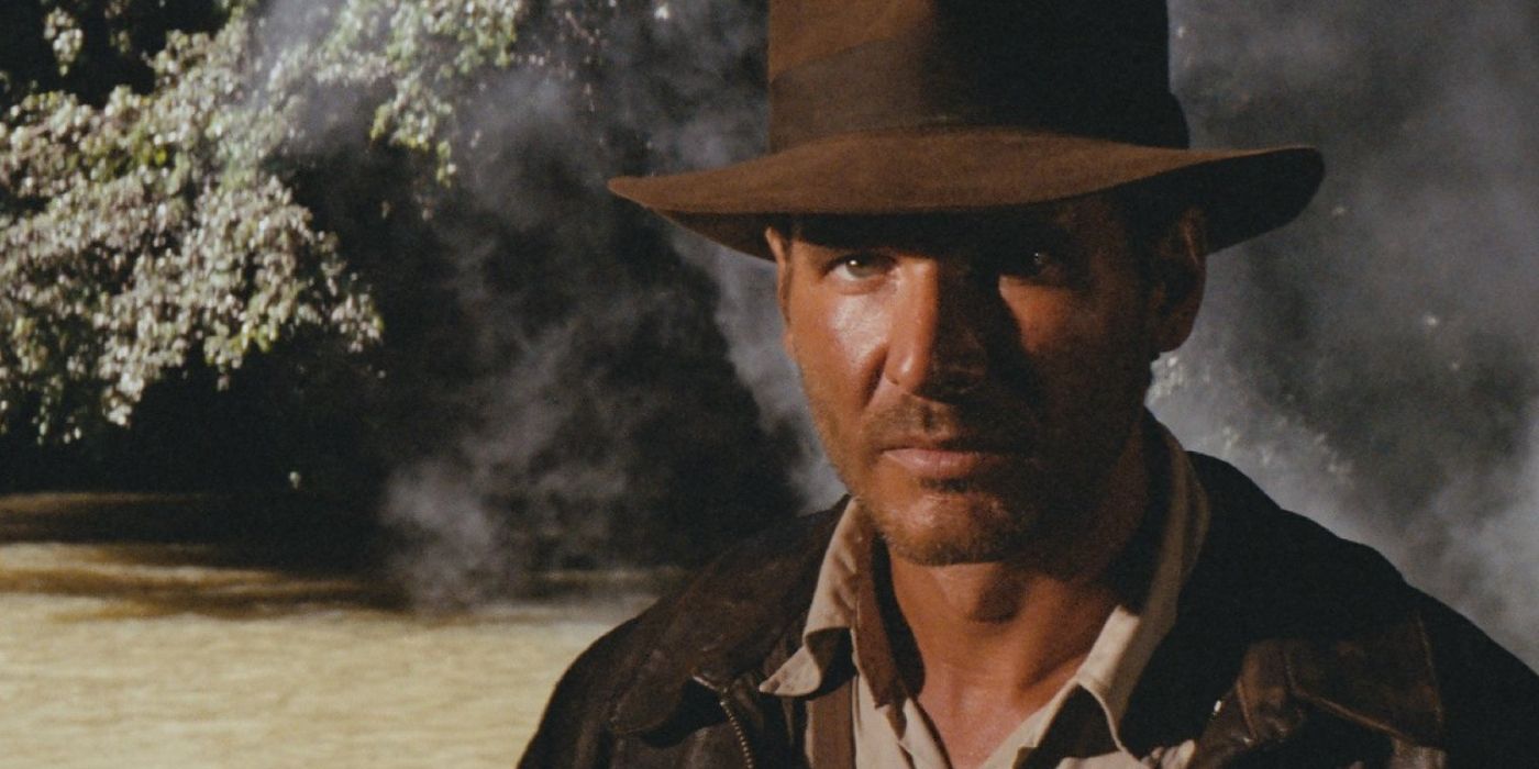 Screencap of Indiana Jones emerging from the smoke in Raiders of the Lost Ark's opening scene.