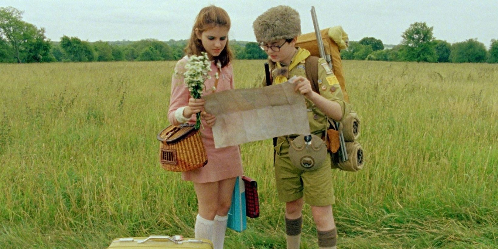 Sam and Suzy in a field in Moonrise Kingdom