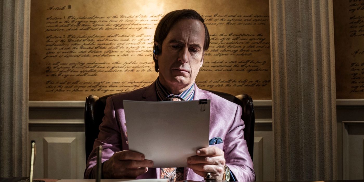 Saul Goodman looking at papers in his office in Better Call Saul 