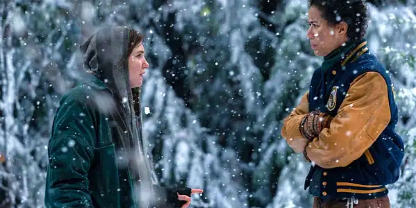 Shauna (Sophie Nélisse) and Taissa (Jasmin Savoy Brown) having an argument in the snow Yellowjackets
