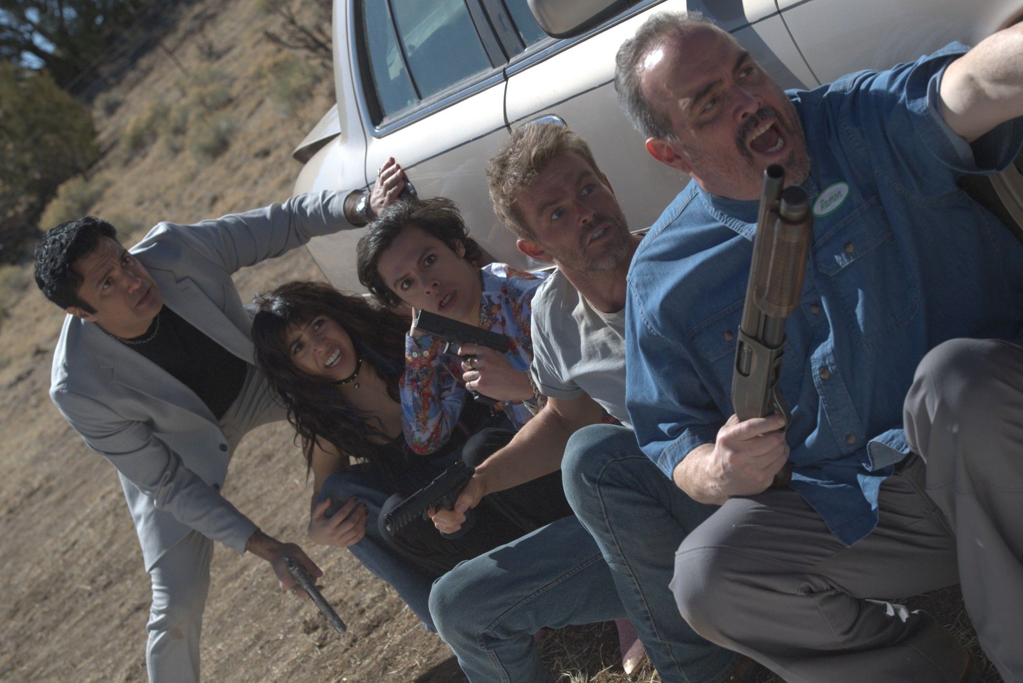 Snag scene showing five characters taking cover behind a car during a fight holding their guns.