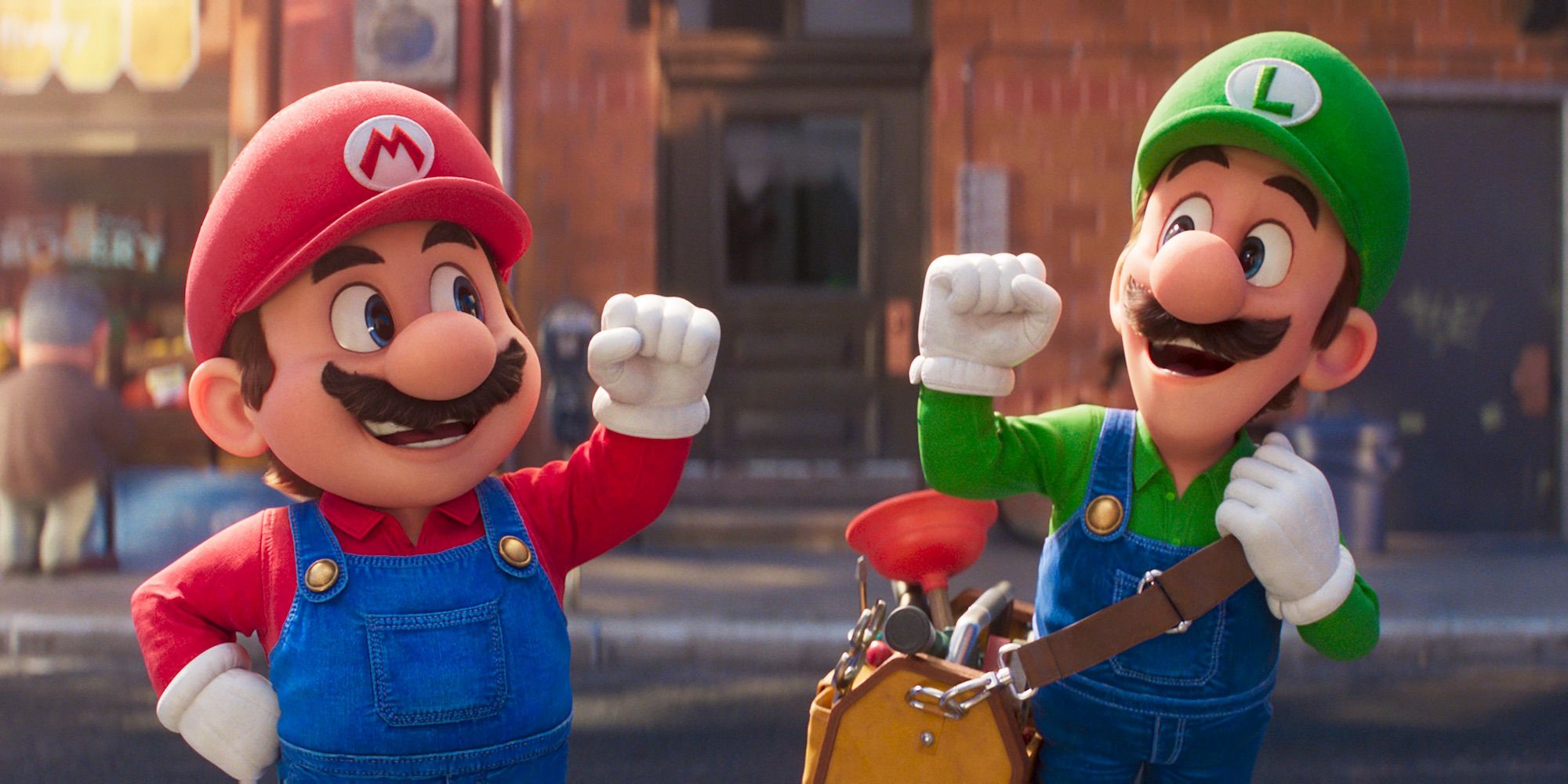 Mario and Luigi raises their fist and smile at each other in Super Mario Bros Movie